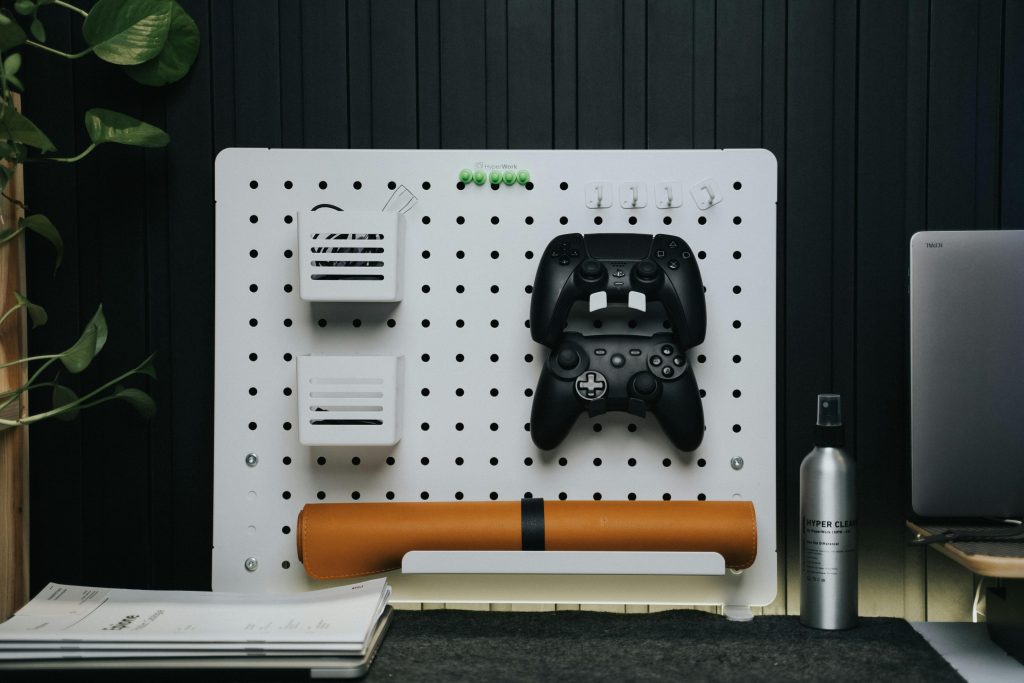 A Board with Game Controllers Standing on the Desk